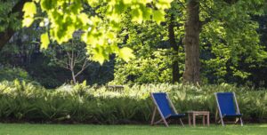 View of garden with two deckchairs